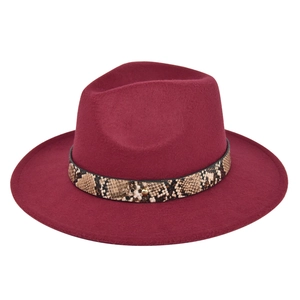 Detail of burgundy wool fedora featuring snake print band and golden metal rivet