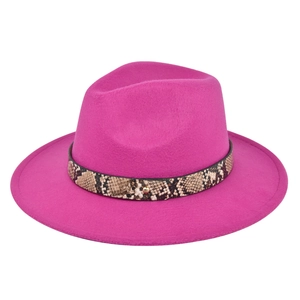 Close-up of fuchsia wool fedora hat featuring a snake print band and gold metal rivet
