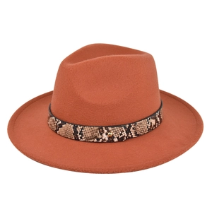 Detail of burnt orange fedora hat featuring snakeskin leather band and metallic stud