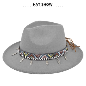 Detail view of grey fedora hat with ethnic woven band and silver metal heart charms