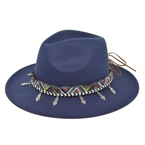Navy blue fedora hat detail featuring ethnic geometric ribbon and silver heart charms