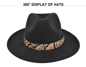 Detail of black fedora hat featuring a stylish snakeskin patterned band with gold studs