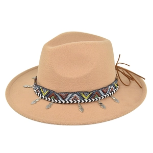 Close-up of wide-brim felt fedora featuring tribal woven band and metal leaf charms