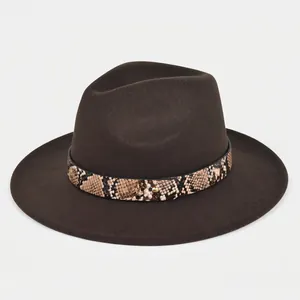 Dark brown wide brim wool fedora hat with snakeskin band and gold metal rivet detail