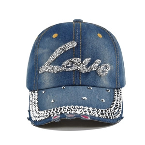 Distressed blue denim baseball cap with sparkling rhinestone Love logo and metal studs