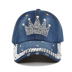 Distressed denim baseball cap with rhinestone crown and silver studded brim for street style