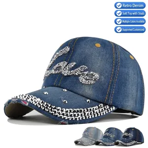 Distressed blue denim baseball cap with sparkling rhinestone Love pattern and crystal brim