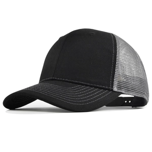 Detail view of black cotton front and grey breathable mesh on a classic trucker hat
