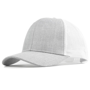 Detail view of a grey and white trucker hat featuring breathable mesh and curved brim