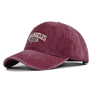 Vintage burgundy washed cotton baseball cap with Los Angeles 1850 embroidery on white background