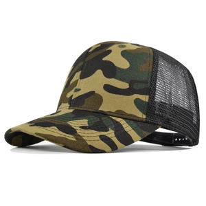 Detail shot of camo trucker hat with breathable black mesh and curved brim design