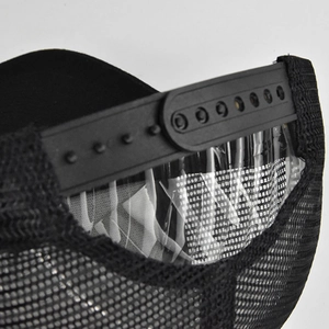 Detail of adjustable snapback closure and breathable mesh on a black trucker baseball hat