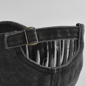 Detail of adjustable metal buckle on vintage washed cotton Los Angeles baseball cap