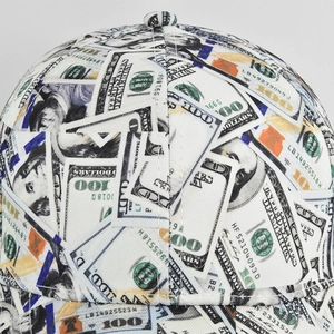 Detailed macro view of white canvas baseball cap with dollar bill print and fine stitching