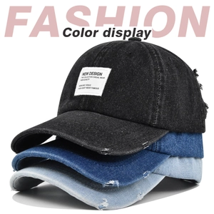 Three stacked vintage distressed denim baseball caps in black, dark blue, and light blue