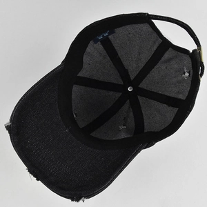 Internal view of a distressed black denim baseball cap with sweatband and metal buckle