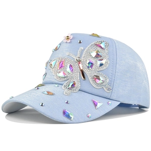 Light blue baseball cap with shimmering rhinestones and a crystal butterfly design