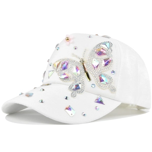 Detail of white baseball cap with rhinestone butterfly patch and colorful diamond studs