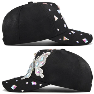 Detailed view of black baseball cap featuring 3D butterfly applique and colorful rhinestones