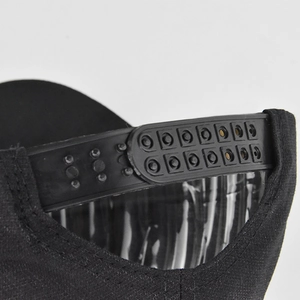 Detail of adjustable black snapback strap on a butterfly diamond baseball cap
