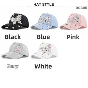 Detail view of multi-colored butterfly rhinestone patterns on various baseball cap colors
