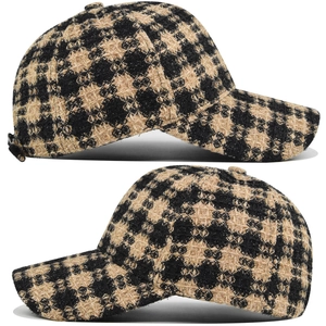 Close-up of black and yellow tweed plaid baseball cap with thick textured fabric weave