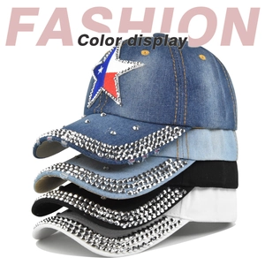 Detail view of denim and cotton baseball caps featuring rhinestone stars and Texas flags