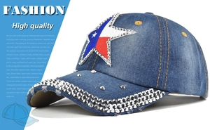 Close-up of denim baseball cap featuring Texas star patch with rhinestones and metal studs