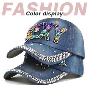 Detail of denim baseball hats with sparkling rhinestone SEXY lettering and crystal trim