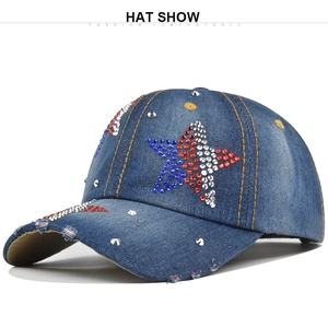 Macro shot of blue denim baseball cap with colored rhinestones and metal rivets detail