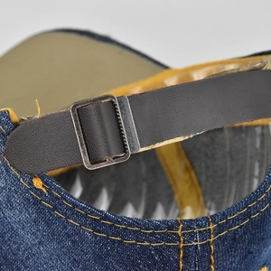 Deep blue denim baseball cap featuring retro leather back strap and metal buckle