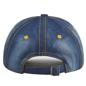 Detail of blue denim baseball cap showing yellow stitching and metal back buckle