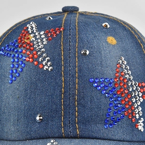 Denim baseball cap with sparkling rhinestone stars and classic yellow stitching details