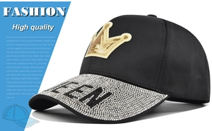 Detail of baseball cap showing crown patch and rhinestone QUEEN text on the brim