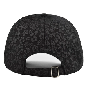 Detail of black baseball cap back with floral texture and silver metal adjustable buckle
