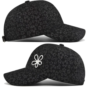 Detail of black baseball cap with 3D floral texture and sparkling rhinestone flower accents