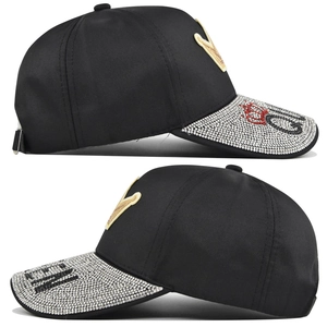 Detail of baseball cap with rhinestone crown pattern and Queen slogan embroidery