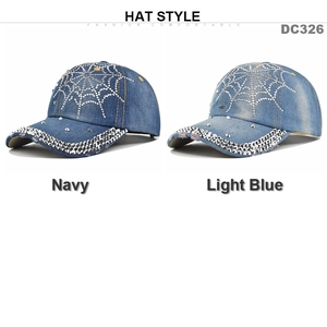 Detail of rhinestone spider web and large crystals on navy and light blue denim caps