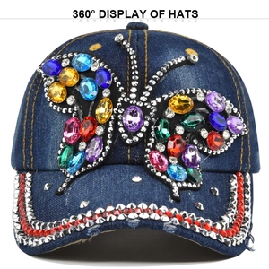 Blue denim baseball cap with colorful rhinestone butterfly and studded curved brim edge