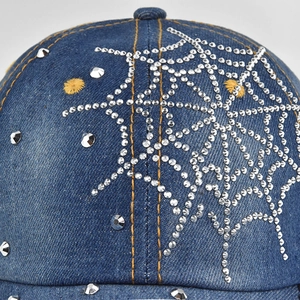 Blue denim baseball cap featuring silver rhinestone spiderweb and yellow star embroidery