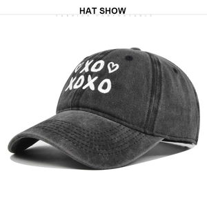 Detail of vintage washed grey baseball cap with high-quality XOXO 3D embroidery texture