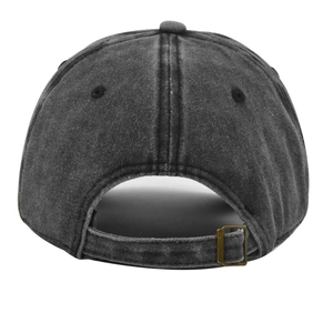 Detail view of washed cotton baseball cap with adjustable bronze metal buckle back