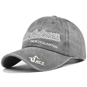 Close-up of New Orleans 3D embroidery on a vintage washed grey cotton baseball cap