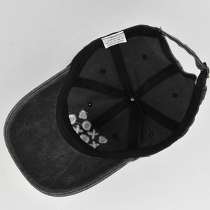 Detailed internal view of cotton baseball cap showing stitching and XOXO embroidery