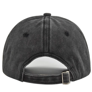 Close-up of adjustable metal buckle and washed distressed fabric on vintage baseball cap