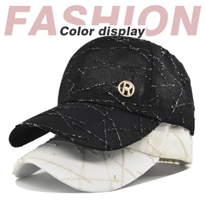 Detail of baseball caps showing silver metallic embroidery and golden letter R logo