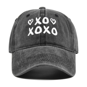 Vintage washed charcoal cotton baseball cap with white XOXO heart embroidery on crown
