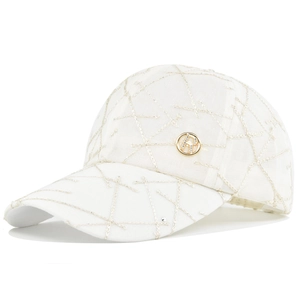 White quilted baseball cap with gold diamond stitching and a circular metal H-logo badge