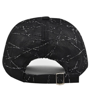 Detail view of black baseball cap featuring metallic silver embroidery and adjustable buckle