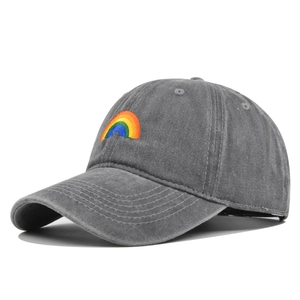 Vintage washed dark grey baseball cap featuring a rainbow embroidery and a curved brim